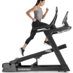 woman running on incline trainer watching screen