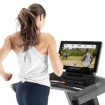 woman watching treadmill screen