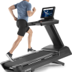 man running on treadmill watching screen