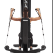 Woman sitting using Multi-Plane Shoulder machine