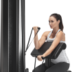woman using biceps machine