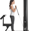 woman using biceps machine