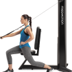 woman using tricep machine