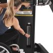 woman in wheelchair adjusting machine